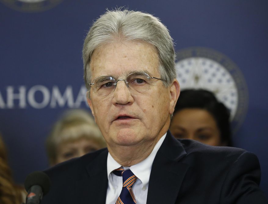 In this March 28, 2018 file photo, former U.S. Sen. Tom Coburn speaks at a news conference in Oklahoma City. Coburn died on March 28, 2020. Thanks to a 2010 provision to eliminate duplication in government-agency spending that he wrote, some $393 billion in cost savings for the federal government has been realized, according to a report published May 19 by the Government Accountability Office.  (AP Photo/Sue Ogrocki, File) **FILE**