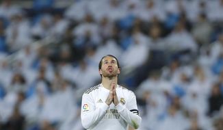 Real Madrid&#39;s Sergio Ramos reacts during the Spanish La Liga soccer match between Real Madrid and Barcelona at the Santiago Bernabeu stadium in Madrid, Spain, Sunday, March 1, 2020. (AP Photo/Manu Fernandez)