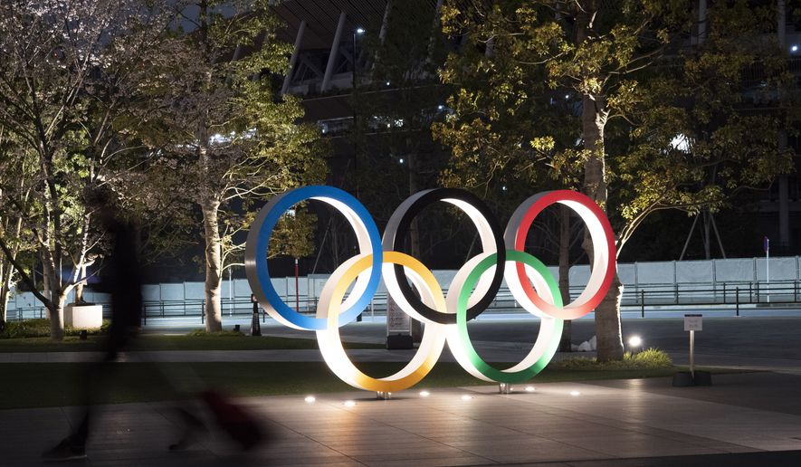 The Olympic rings are seen Monday, March 30, 2020, in Tokyo. The Tokyo Olympics will open next year in the same time slot scheduled for this year&#39;s games. Tokyo organizers said Monday the opening ceremony will take place on July 23, 2021. (AP Photo/Jae C. Hong)