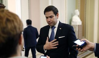 Sen. Marco Rubio, R-Fla., speaks with reporters on Capitol Hill in Washington, Tuesday, March 24, 2020, as the Senate works to pass a coronavirus relief bill. (AP Photo/Patrick Semansky) ** FILE **
