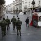In this March 26, 2020, photo, Serbian army soldiers patrol in Belgrade&#39;s main pedestrian street, in Serbia. Since declaring nationwide state of emergency Serbian President Aleksandar Vucic has suspended parliament, giving him widespread powers such as closing borders and introducing a 12-hour curfew. (AP Photo/Darko Vojinovic)