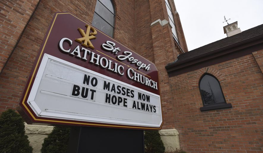 In this file photo, a sign at St. Joseph Catholic Church in St. Joseph, Mich., encourages hope Monday, March 30, 2020, as schools and churches across the country are closed due to COVID-19. A survey published in Oct. 2021 of more than 15,000 religious congregations spanning multiple faiths forecasts that some 30% of congregations active today may close in the next two decades due to aging populations and declining attendance by younger worshipers.  (Don Campbell/The Herald-Palladium via AP)  **FILE**