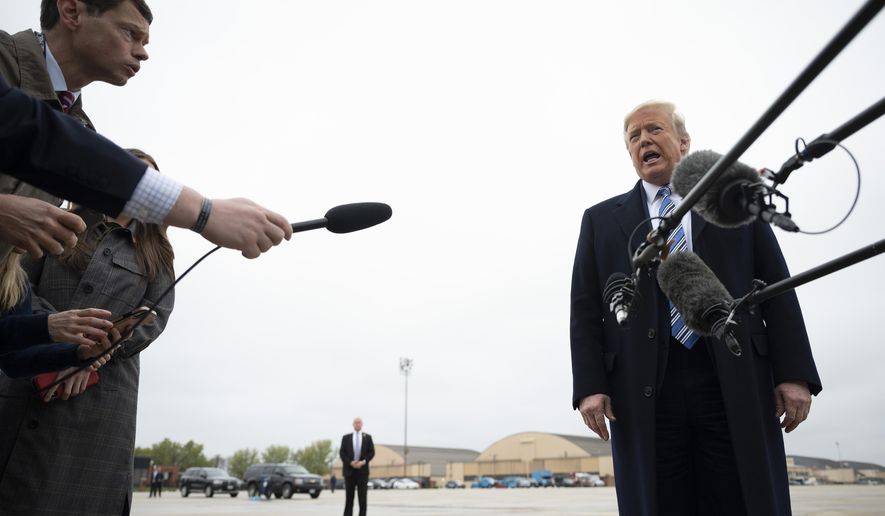 President Donald Trump speaks to the press before boarding Air Force One in Andrews Air Force Base, Md., Saturday, March 28, 2020. Trump is en route to Norfolk, Va., for the sailing of the USNS Comfort, which is headed to New York. (Jim Watson/Pool Photo via AP)