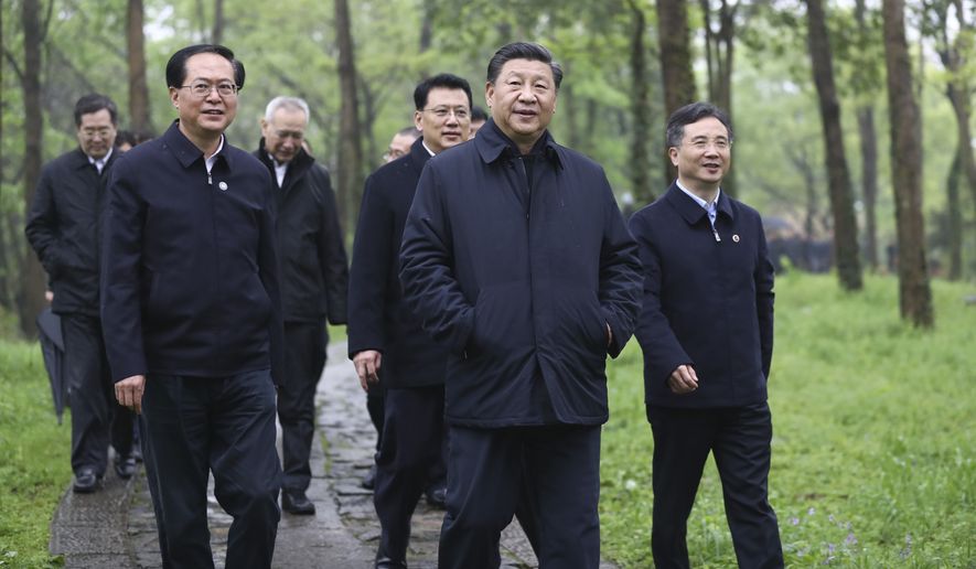 In this photo released by Xinhua News Agency, Chinese President Xi Jinping, second right, visits the Xixi National Wetland Park during an inspection in Hangzhou, in eastern China&#39;s Zhejiang Province, on Tuesday, March 31, 2020. The ruling Communist Party is trying to revive the world&#39;s second-largest economy after declaring victory over the coronavirus even as the United States and other governments shut down businesses. (Yan Yan/Xinhua via AP)