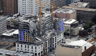 FILE - This Oct. 12, 2019, file photo, shows damage of a partial collapse at the Hard Rock Hotel under construction in New Orleans. Dozens of protesters marched from the site of the partially collapsed Hard Rock Hotel on the edge of the French Quarter to City Hall on Friday, Jan. 24, 2020 demanding that something be done about the hotel and that the two bodies still inside be recovered.  (AP Photo/Gerald Herbert, File)
