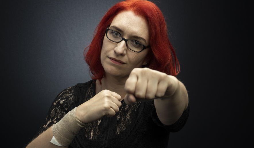 This March 16, 2020 file photo shows entertainment publicist Annie Jeeves posing for a portrait in Los Angeles. Jeeves says she would have been bouncing from city to city, with film festivals, launching different films and preparing for the Cannes Film Festival. "Corona(virus) derailed me," Jeeves said. The uncertainty is devastating for independent contractors and freelancers who depend on steady income to survive. (Photo by Willy Sanjuan/Invision/AP)