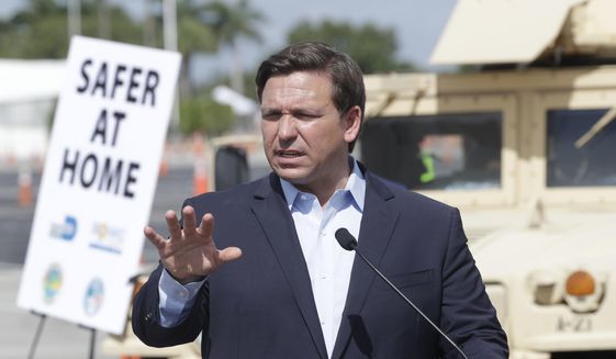Florida Gov. Ron DeSantis speaks during a news conference at a drive-through coronavirus testing site in front of Hard Rock Stadium, Monday, March 30, 2020, in Miami Gardens, Fla. Gov. Ron DeSantis doesn&#39;t want the people on the Holland America&#39;s Zandaam where four people died and others are sick to be treated in Florida, saying the state doesn&#39;t have the capacity to treat outsiders as the coronavirus outbreak spreads. (AP Photo/Wilfredo Lee)