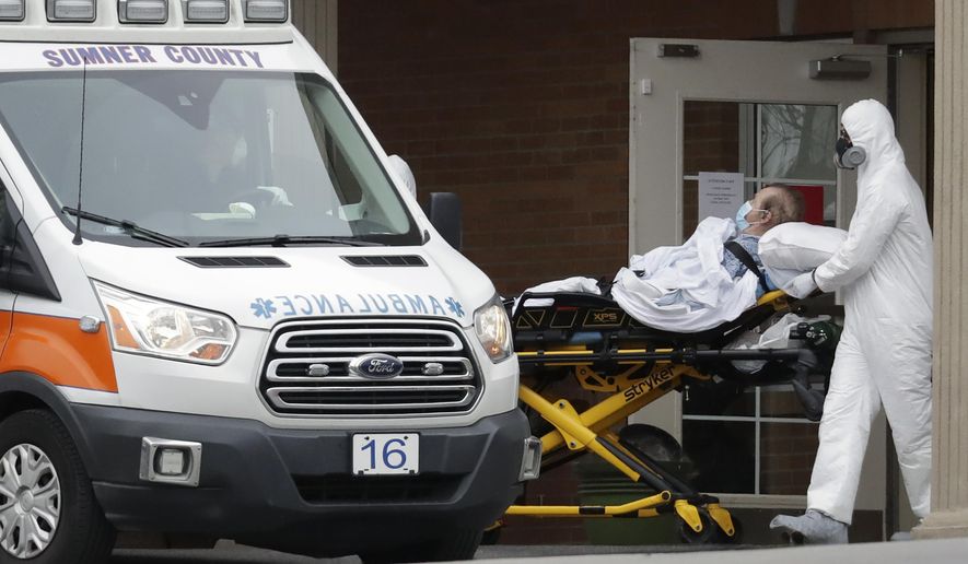 A resident is removed from the Gallatin Center for Rehabilitation and Healing, Monday, March 30, 2020, in Gallatin, Tenn. Multiple people tested positive for the coronavirus at the facility Friday. Tennessee Gov. Bill Lee issued a statewide "safer-at-home" order on Monday to help stem the state's rapid spread of coronavirus, mandating the closure of all nonessential businesses while urging residents to remain at home whenever possible for the next two weeks. (AP Photo/Mark Humphrey)