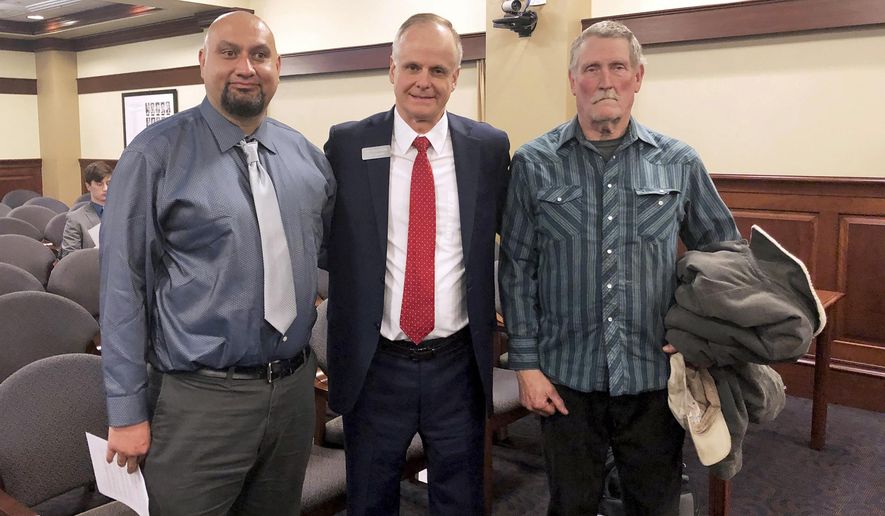 FILE - In this Feb. 11, 2020, file photo, from left, Christopher Tapp, Republican Rep. Doug Ricks and Charles Fain appeared before the Idaho House Judiciary, Rules and Administration Committee in Boise, Idaho, to testify in favor of legislation that would compensate the wrongly convicted. Tapp and Fain combined spent nearly 40 years in Idaho prisons for crimes they didn't commit after being convicted of murder. Idaho Gov. Brad Little has vetoed legislation that would have set up a process to compensate people convicted of crimes they didn't commit. The Republican governor in his veto message on Monday, March 31, 2020, says the measure's objective is admirable, but its process using the courts is flawed. (AP Photo/Keith Ridler, File)