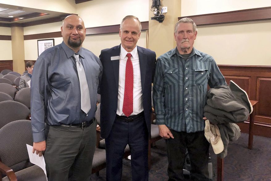 FILE - In this Feb. 11, 2020, file photo, from left, Christopher Tapp, Republican Rep. Doug Ricks and Charles Fain appeared before the Idaho House Judiciary, Rules and Administration Committee in Boise, Idaho, to testify in favor of legislation that would compensate the wrongly convicted. Tapp and Fain combined spent nearly 40 years in Idaho prisons for crimes they didn't commit after being convicted of murder. Idaho Gov. Brad Little has vetoed legislation that would have set up a process to compensate people convicted of crimes they didn't commit. The Republican governor in his veto message on Monday, March 31, 2020, says the measure's objective is admirable, but its process using the courts is flawed. (AP Photo/Keith Ridler, File)