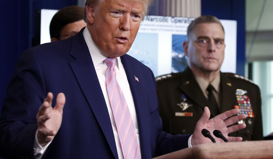 President Donald Trump speaks about the coronavirus in the James Brady Press Briefing Room of the White House, Wednesday, April 1, 2020, in Washington, as Chairman of the Joint Chiefs Gen. Mark Milley, listens. (AP Photo/Alex Brandon)