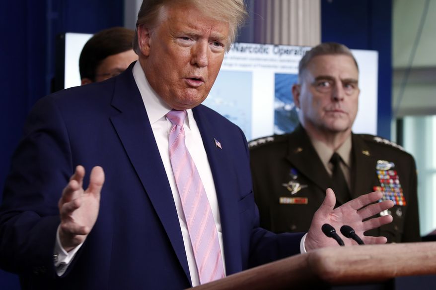President Donald Trump speaks about the coronavirus in the James Brady Press Briefing Room of the White House, Wednesday, April 1, 2020, in Washington, as Chairman of the Joint Chiefs Gen. Mark Milley, listens. (AP Photo/Alex Brandon)
