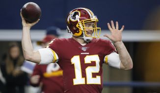 FILE - In this Dec. 15, 2019 file photo Washington Redskins quarterback Colt McCoy (12) throws before an NFL football game against the Dallas Cowboys in Arlington, Texas. After spending much of the past six seasons as a backup quarterback with the Redskins, Colt McCoy knows his job coming to the New York Giants. His primary task is to help offensive coordinator Jason Garrett and new coach Joe Judge get starting quarterback Daniel Jones, ready to play every week. Be another set of eyes, another set of ears, another encouraging voice for the second-year player. (AP Photo/Michael Ainsworth, file)