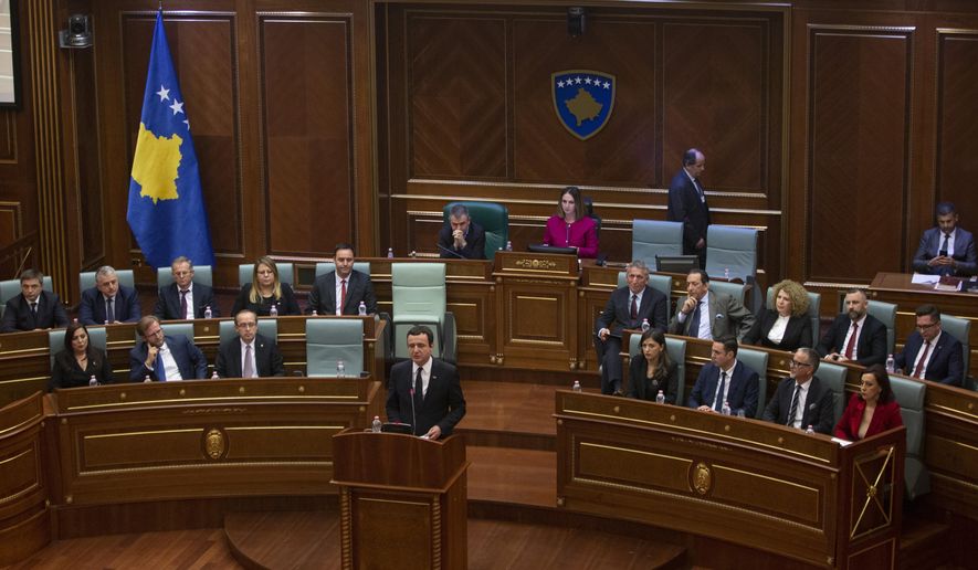 Albin Kurti, foreground, the newly elected prime minister of Kosovo delivers a speech, in the capital Pristina, Monday, Feb. 3, 2020.  Kosovo&#x27;s parliament convened on Monday to vote in a new prime minister after four months of talks between the country&#x27;s two main parties. (AP Photo/Visar Kryeziu)