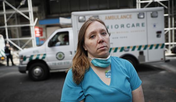 Registered Nurse Elizabeth Schafer, 36, of South St. Paul, Minn., stands for a portrait before entering Beth Israel Mount Sinai Hospital for her second day volunteering to combat the COVID-19 pandemic, Wednesday, April 1, 2020, in New York. Schafer left her home in the Midwest to volunteer in New York where she says the situation inside the hospital is grim. &amp;quot;I took an oath as a nurse to do no harm and just go where I was needed,&amp;quot; Schafer said. &amp;quot;I told my students, you step up to the plate when you&#39;re needed as a nurse, all the time, no matter what. And so right now, you either go to the West Coast or the East Coast as a nurse. And so here I am.&amp;quot; (AP Photo/John Minchillo)