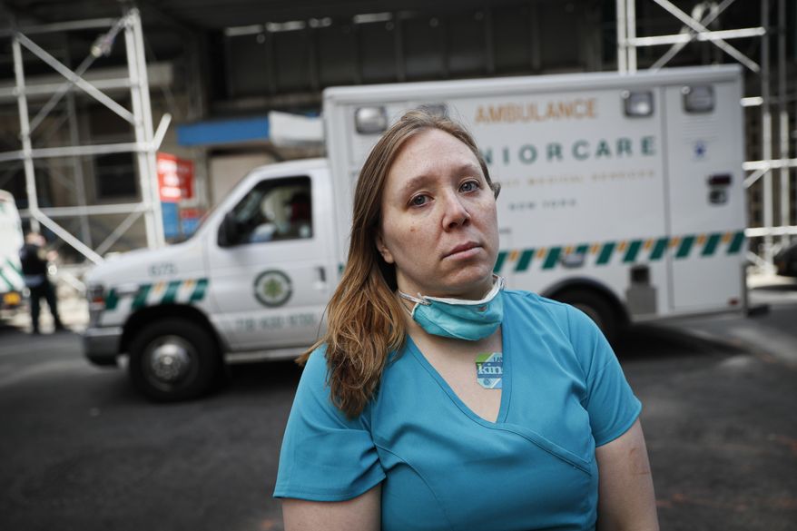 Registered Nurse Elizabeth Schafer, 36, of South St. Paul, Minn., stands for a portrait before entering Beth Israel Mount Sinai Hospital for her second day volunteering to combat the COVID-19 pandemic, Wednesday, April 1, 2020, in New York. Schafer left her home in the Midwest to volunteer in New York where she says the situation inside the hospital is grim. &amp;quot;I took an oath as a nurse to do no harm and just go where I was needed,&amp;quot; Schafer said. &amp;quot;I told my students, you step up to the plate when you&#39;re needed as a nurse, all the time, no matter what. And so right now, you either go to the West Coast or the East Coast as a nurse. And so here I am.&amp;quot; (AP Photo/John Minchillo)