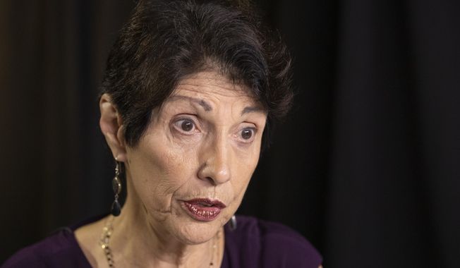 FILE - In this June 19, 2019, file photo, Diane Foley, mother of journalist James Foley, who was killed by the Islamic State terrorist group in a graphic video released online, speaks to the Associated Press during an interview in Washington. Family members of Americans who are imprisoned abroad or held hostage by militant groups say in a new report that the U.S. government must do better in communicating with them. The report from the James W. Foley Legacy Foundation is based on interviews with 25 former hostages and detainees as well as their relatives and advocates. (AP Photo/Manuel Balce Ceneta, File)