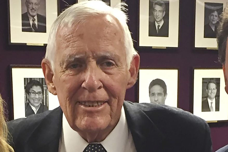 In this photo provided by Karen Kaiser, Judge Kevin Thomas Duffy poses for a picture at his retirement party at the Federal Courthouse in New York on Sept. 19, 2016. Duffy, a longtime judge who presided over three major New York terrorism trials in the 1990s, died Wednesday, April 1, 2020, of COVID-19, the disease caused by the coronavirus. He was 87. (Courtesy of Karen Kaiser via AP)