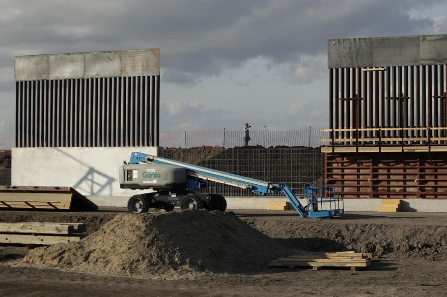 In this Nov. 7, 2019, file photo, the first panels of levee border wall are seen at a construction site along the U.S.-Mexico border, in Donna, Texas. (AP Photo/Eric Gay, File)