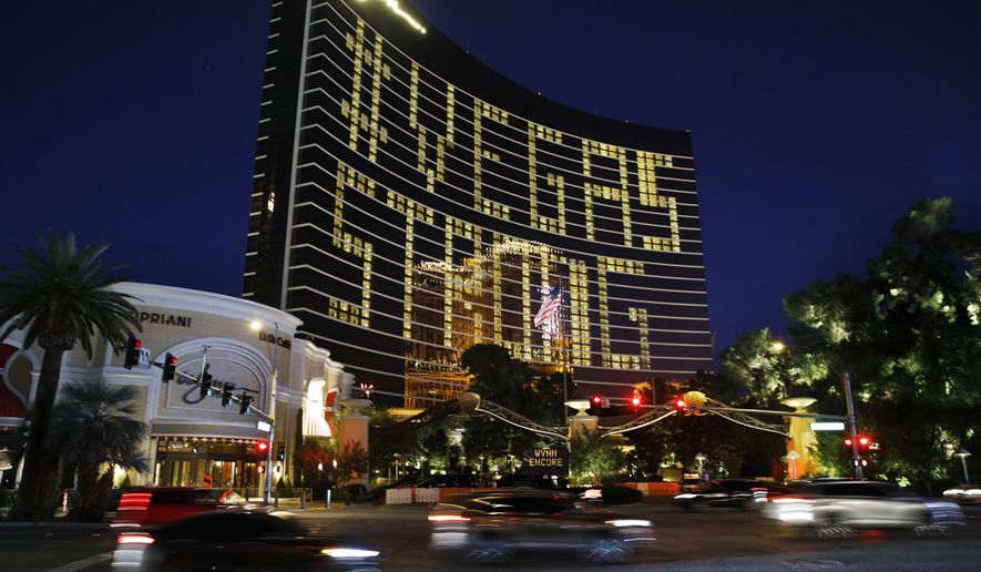 Hotel room lights spell out &amp;quot;Vegas Strong&amp;quot; at the Wynn hotel-casino along the Las Vegas Strip as casinos and other business are shuttered due to the coronavirus outbreak Wednesday, April 1, 2020, in Las Vegas. (AP Photo/John Locher)