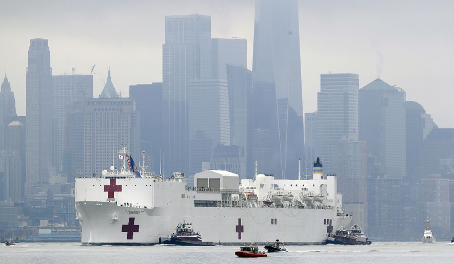 The Navy hospital ship USNS Comfort passes lower Manhattan on its way to docking in New York, Monday, March 30, 2020. The ship has 1,000 beds and 12 operating rooms that could be up and running within 24 hours of its arrival on Monday morning. It&#39;s expected to bolster a besieged health care system by treating non-coronavirus patients while hospitals treat people with COVID-19. AP Photo/Seth Wenig)