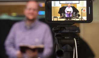 Cross Point Church Pastor Keith Williams preaches to his congregation via online video due to the ongoing COVID-19 pandemic.. The Bristol Tennessee church has gone to strictly online services and are planning for Easter to be online as well. (David Crigger/Bristol Herald Courier via AP)