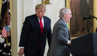 In this Nov. 6, 2019, file photo President Donald Trump invites Senate Majority Leader Mitch McConnell, R-Ky., to speak in the East Room of the White House during a ceremony where Trump spoke about his judicial appointments in Washington.  Trump is nominating Justin Walker, a 37-year-old judge and former clerk to Supreme Court Justice Brett Kavanaugh, to a seat on the powerful U.S. Court of Appeals for the District of Columbia Circuit. Walker of Kentucky is one of the youngest federal judges in the country. He has deep ties to McConnell. (AP Photo/Manuel Balce Ceneta, File)  **FILE**