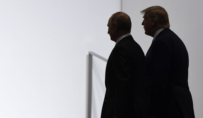 In this June 28, 2019, photo, President Donald Trump and Russian President Vladimir Putin walk to participate in a group photo at the G20 summit in Osaka, Japan. An odd new front in the U.S.-Russian rivalry has emerged as a Russian military cargo plane bearing a load of urgently needed medical supplies landed in New York&#x27;s JFK airport. (AP Photo/Susan Walsh, File)