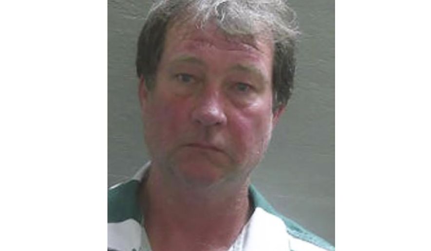 This booking photo provided by Escambia County Corrections shows Daniel Wells. Pensacola detectives arrested Wells on Wednesday, March 18, 2020 and charged him with the slaying of Tonya McKinley, 23, whose body was found before dawn on New Year's Day 1985. She had been strangled and sexually assaulted, according to the Pensacola News Journal. She left behind an 18-month-old son. (Escambia County Corrections via AP)