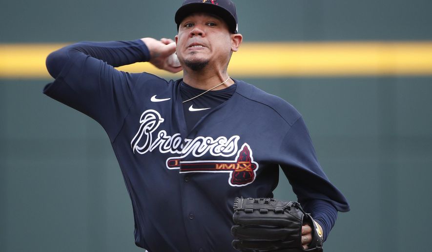 Atlanta Braves starting pitcher Felix Hernandez warms up for a spring training baseball game against the Tampa Bay Rays, Tuesday, March 3, 2020, in Venice, Fla. (AP Photo/Elise Amendola)