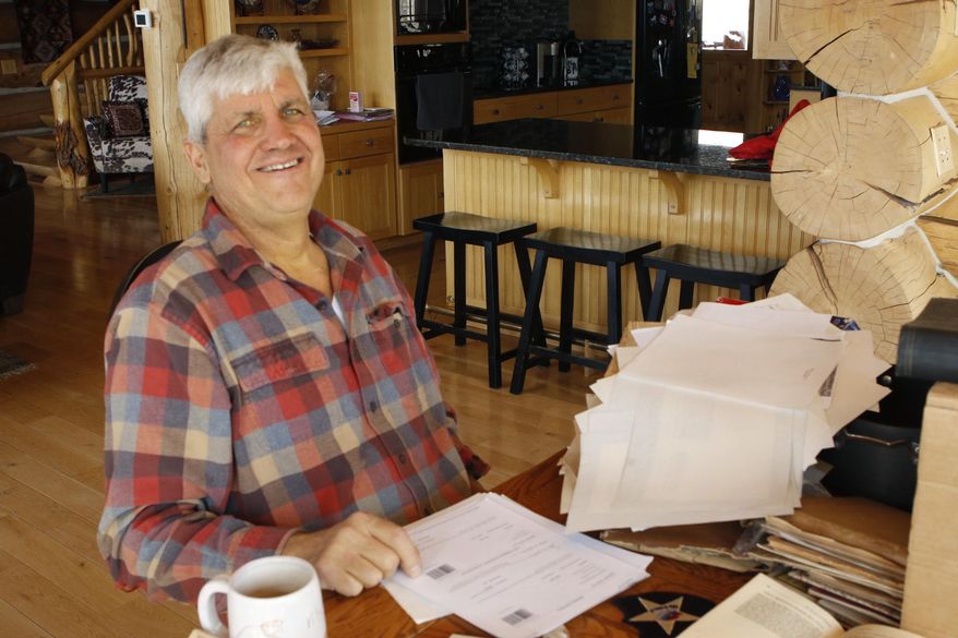 In this photo taken March 26, 2020, David M. Nelson, is seen at his home outside Cody, Wyoming. Nelson has worked to crack codes contained in letters his grandfather wrote from Europe during World War II. Written by his grandfather Victor Nelson, some hidden messages were simple, while others revealed information no military censor would let pass if they knew, like the town in Belgium Victor was stationed in at one point in 1944. (Zac Taylor/The Cody Enterprise via AP)