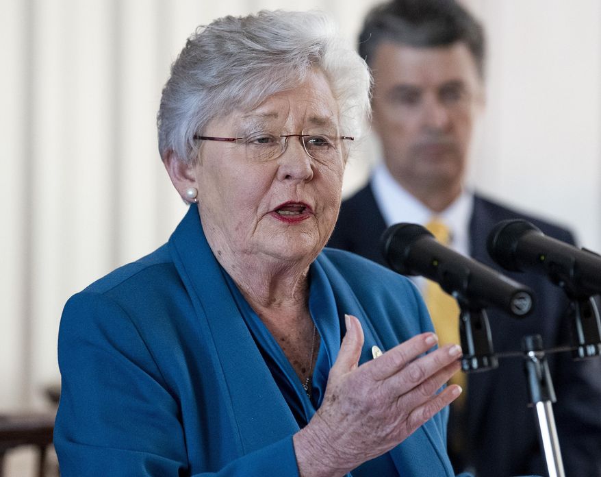 Alabama Gov. Kay Ivey announces that she is putting the state under a shelter-in-place order during a briefing at the state capitol building in Montgomery, Ala., Friday, April 3, 2020. (Mickey Welsh/The Montgomery Advertiser via AP)