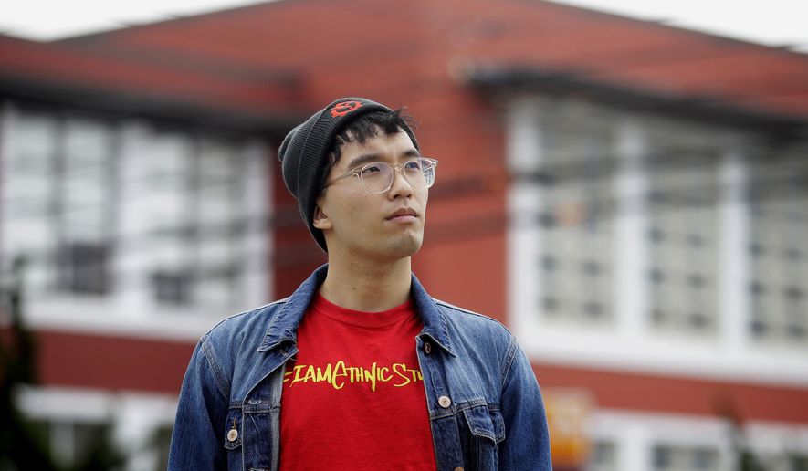 In this March 31, 2020, photo, Kyle Navarro poses in San Francisco. The school nurse was recently unlocking his bicycle when an older white man called him a racial slur and spat at him. Asian Americans are using social media to organize and fight back against racially motivated attacks during the coronavirus pandemic, which the FBI predicts will increase as infections grow. (AP Photo/Jeff Chiu)