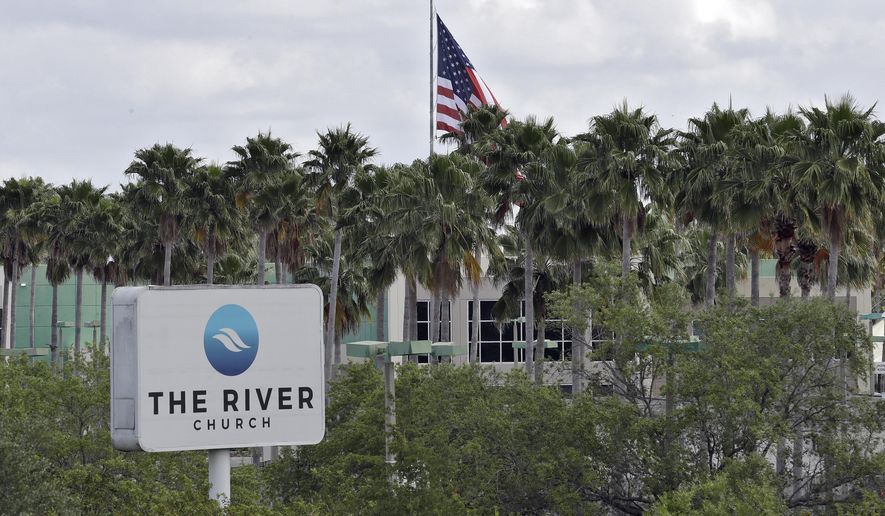 FILE - This Monday, March 30, 2020 file photo shows The River Church in Tampa, Fla. Pastor Rodney Howard-Browne was arrested Monday, March 30, 2020, for violating a county order by hosting a large number of congregants at the church. (AP Photo/Chris O'Meara)