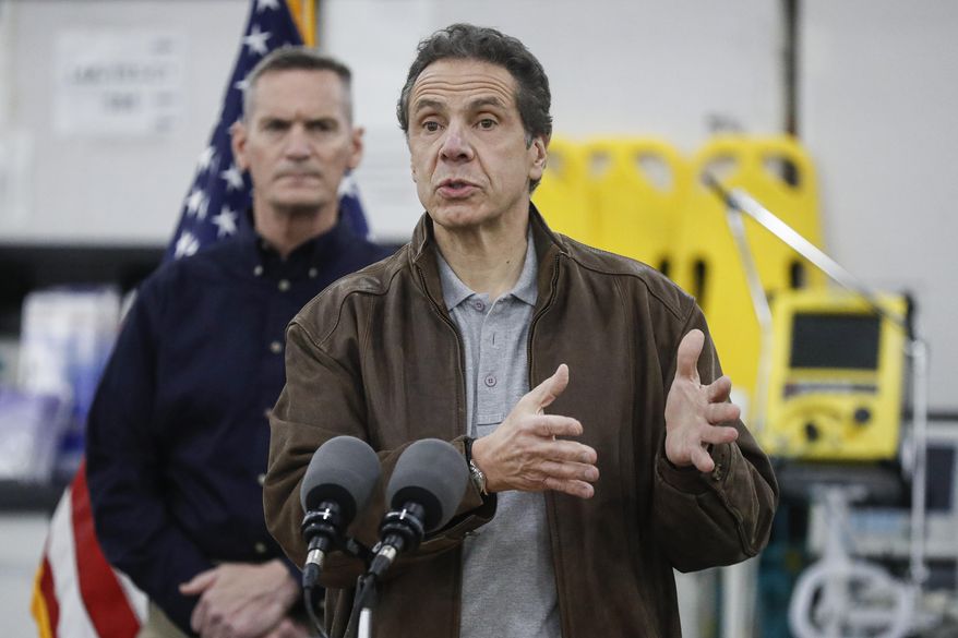 New York Gov. Andrew Cuomo speaks during a news conference alongside the National Guard at the Jacob Javits Center that will house a temporary hospital in response to the COVID-19 outbreak, Monday, March 23, 2020, in New York. (AP Photo/John Minchillo) ** FILE **