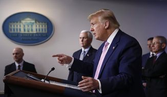 President Donald Trump speaks during a coronavirus task force briefing at the White House, Saturday, April 4, 2020, in Washington. Standing alongside are Food and Drug Administration Commissioner Dr. Stephen Hahn, from back left, Vice President Mike Pence and Dr. Anthony Fauci, director of the National Institute of Allergy and Infectious Diseases. (AP Photo/Patrick Semansky) ** FILE **