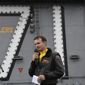 In this Nov. 15, 2019, photo U.S. Navy Capt. Brett Crozier, commanding officer of the aircraft carrier USS Theodore Roosevelt (CVN 71), addresses the crew during an all-hands call on the ship's flight deck. (U.S. Navy Photo by Mass Communication Specialist 3rd Class Nicholas Huynh via AP)