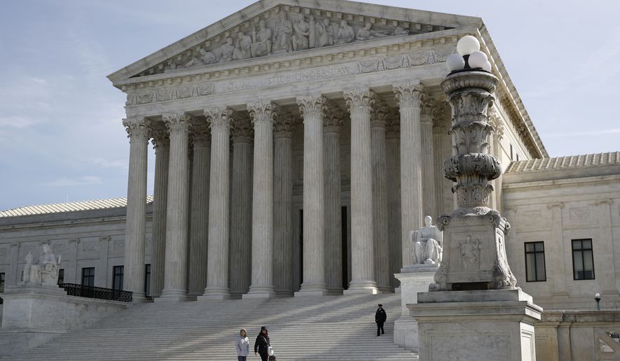 In this March 16, 2020, photo, people walk outside the Supreme Court in Washington. (AP Photo/Patrick Semansky) ** FILE **