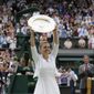 FILE - In this Saturday, July 13, 2019 file photo, Romania&#39;s Simona Halep holds up the trophy after defeating United States&#39; Serena Williams in the women&#39;s singles final match at the Wimbledon Tennis Championships in London.  Wimbledon has been canceled for the first time since World War II because of the coronavirus pandemic. The All England Club announced after an emergency meeting that the oldest Grand Slam tournament in tennis would not be held in 2020. (AP Photo/Kirsty Wigglesworth, File)