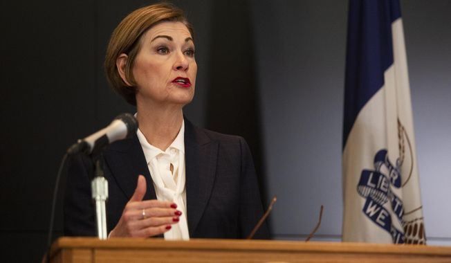 Iowa Gov. Kim Reynolds holds a news conference regarding COVID-19 at the State Emergency Operations Center in Johnston, Iowa, Monday, April 6, 2020. (Oliva Sun/The Des Moines Register via AP, Pool)