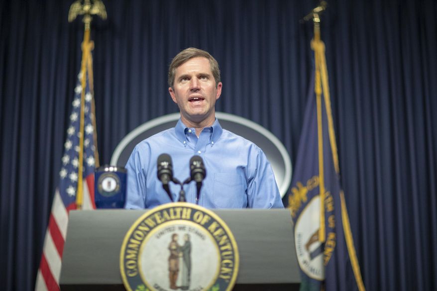 In this Sunday, April 5, 2020, photo, Kentucky Gov. Andy Beshear speaks about the novel coronavirus during a media conference at the state Capitol in Frankfort, Ky. (Ryan C. Hermens/Lexington Herald-Leader via AP)