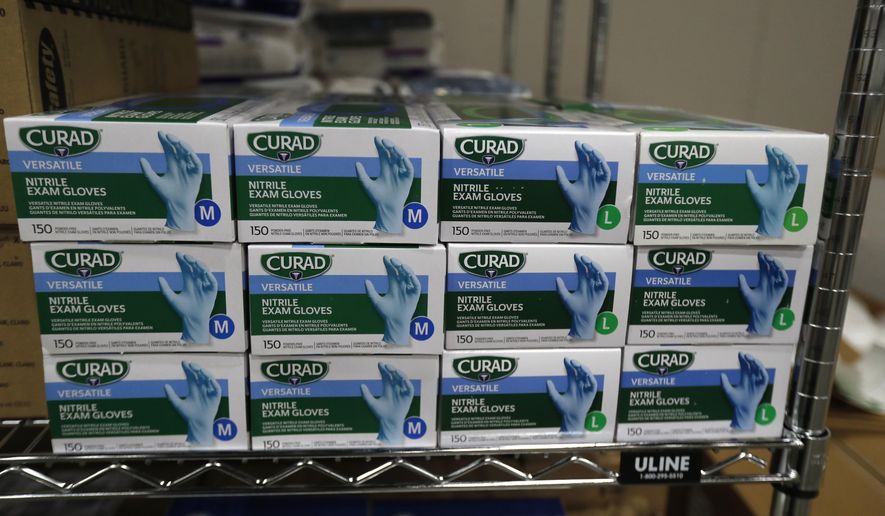 Medical supplies are seen at the TCF Center, Monday, April 6, 2020, in Detroit. The White House said Monday, April 6, that some states are requesting far more medical supplies than they need to fight the coronavirus pandemic, pushing back against criticism that the distribution of vital equipment has been chaotic. (AP Photo/Carlos Osorio)