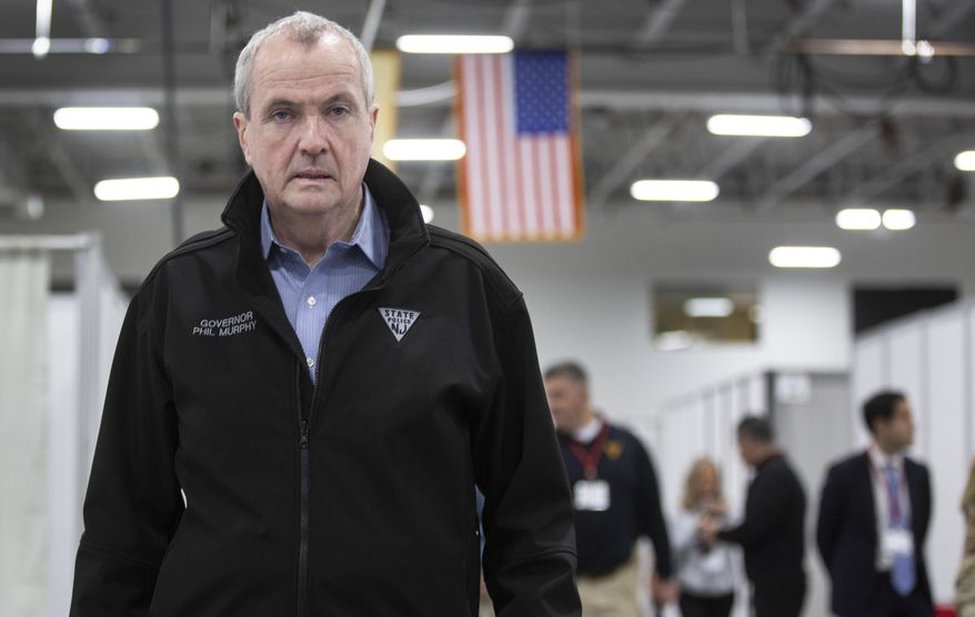 New Jersey Governor Phil Murphy tours the new Field Medical Station for the coronavirus outbreak at the Meadowlands Exposition Center Thursday, April 2, 2020. (Michael Mancuso/NJ Advance Media via AP, Pool)