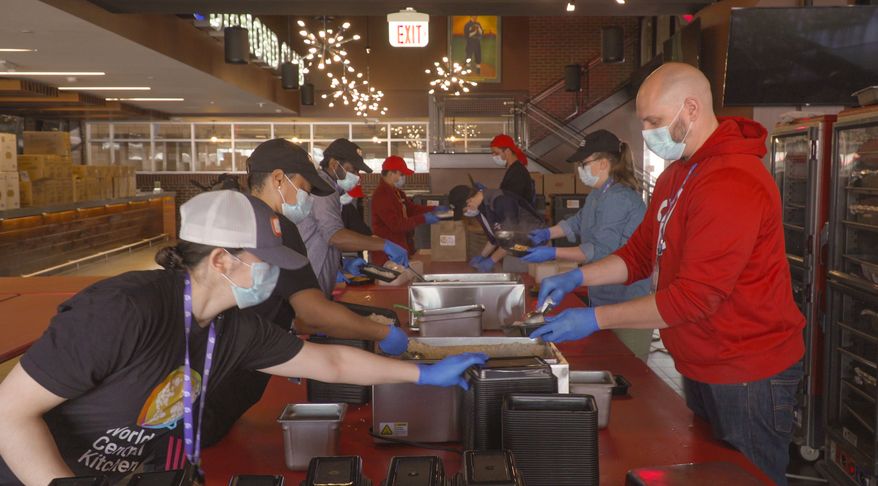 Volunteers for World Central Kitchen, founded by chef and philanthropist José Andrés, prepare meals for those in need during the coronavirus pandemic at Nationals Park in Washington, D.C. on Tuesday, April 7, 2020. (Photo courtesy of Washington Nationals)