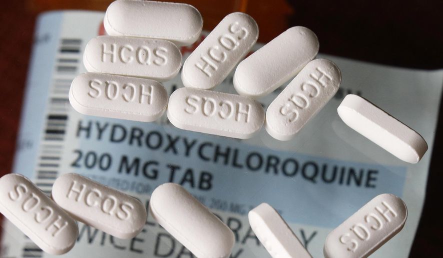 This Monday, April 6, 2020, photo shows an arrangement of hydroxychloroquine pills in Las Vegas. (AP Photo/John Locher)
