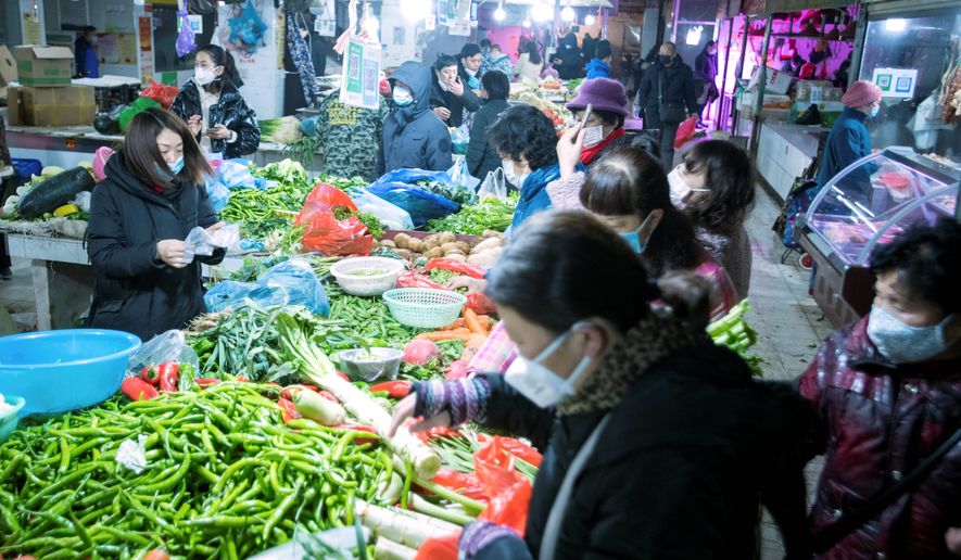 A market in Wuhan, China, has been widely reported to be the origin of the outbreak of a bat virus that erupted into a pandemic, but the market in question does not sell bats. (Associated Press)