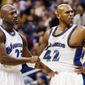 Washington Wizards&#39; Jerry Stackhouse, center, is restrained by teammate Michael Jordan after being called for a first-quarter foul as Los Angeles Lakers&#39; Samaki Walker stands at right Friday, Nov. 8, 2002, in Washington. (AP Photo/Ken Lambert) **FILE**