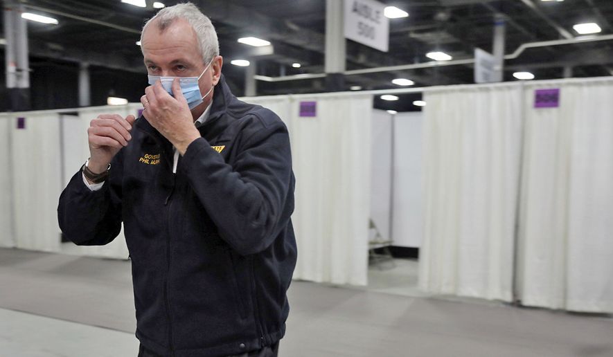 New Jersey Gov. Phil Murphy looks around after touring the Edison Field Medical Station at the site of the N.J. Convention &amp; Exposition Center in Edison, N.J., Wednesday, April 8, 2020. The Exposition Center was converted into a makeshift hospital to handle a possible overflow of patients due to the stress on healthcare facilities due to the spread of COVID-19. (Chris Pedota/The Record via AP, Pool)