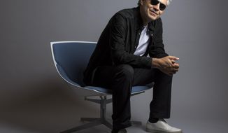 FILE - In this Oct. 29, 2015 file photo, Andrea Bocelli poses for a portrait in New York. Bocelli has released an album, &amp;quot;Cinema,&amp;quot; which includes a duet with pop star Ariana Grande. Bocelli will sing at the Duomo of Milan on Easter Sunday sending a message of love and hope to the world during the coronavirus pandemic, but the Italian tenor says it’s not a concert. Instead, he calls it a “prayer.” (Photo by Drew Gurian/Invision/AP, File)