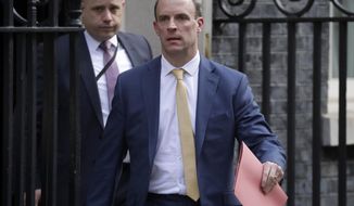 Britain&#39;s Secretary of State for Foreign Affairs, Dominic Raab, leads cabinet members as they leave 10 Downing Street after a meeting as British Prime Minister Boris Johnson was moved to intensive care after his coronavirus symptoms worsened in London, Tuesday, April 7, 2020. Johnson was admitted to St Thomas&#39; hospital in central London on Sunday after his coronavirus symptoms persisted for 10 days. Having been in hospital for tests and observation, his doctors advised that he be admitted to intensive care on Monday evening. The new coronavirus causes mild or moderate symptoms for most people, but for some, especially older adults and people with existing health problems, it can cause more severe illness or death.(AP Photo/Matt Dunham)